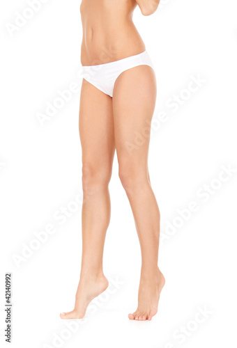 Photo: female legs in white bikini panties female legs in white bikini panties