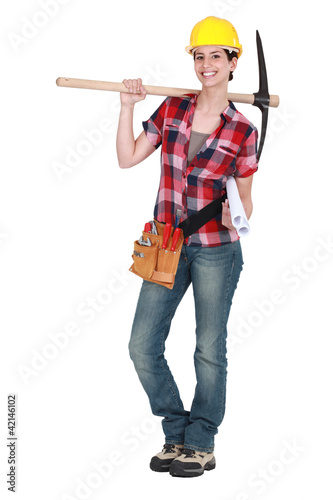 Photo: Woman holding pick-axe Woman holding pick-axe