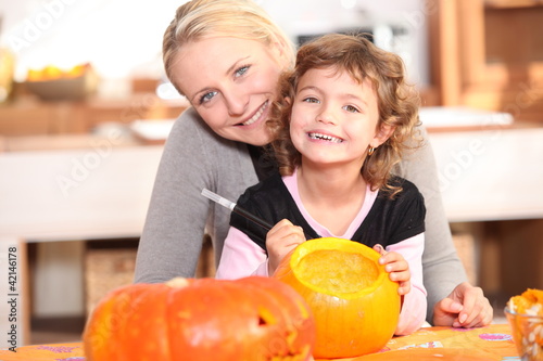 Photo: Mother and daughter pumpkin carving Mother and daughter pumpkin carving