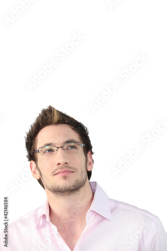 Photo: Young man looking up at the ceiling Young man looking up at the ceiling
