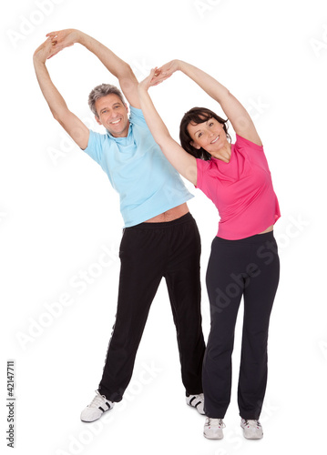 Photo: Active mature couple doing fitness Active mature couple doing fitness