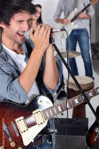 Photo: Man singing in a band Man singing in a band