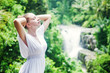 Young woman near waterfall, bali, indonesia