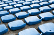 Foto: blue ordered rubber seats in a sports track field blue ordered rubber seats in a sports track field