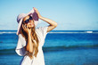 young woman with mobile phone on a beach, bali