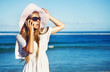 young woman with mobile phone on a beach, bali