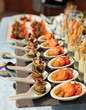 Spoons with seafood snacks