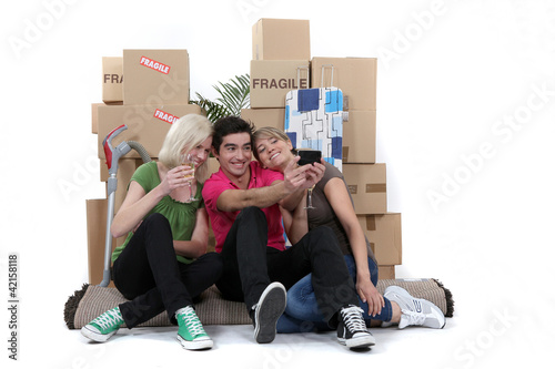 Photo: Friends marking their first day as flatmates Friends marking their first day as flatmates
