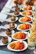 Spoons with seafood snacks
