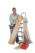 Carpenter with materials and tools