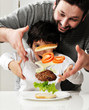 Conceptual photography - flying ingredients of hamburger.