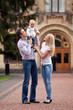 Photo: Caucasian couple with one-year old boy outdoors Caucasian couple with one-year old boy outdoors