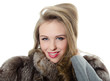 Beautiful girl in a fur hood