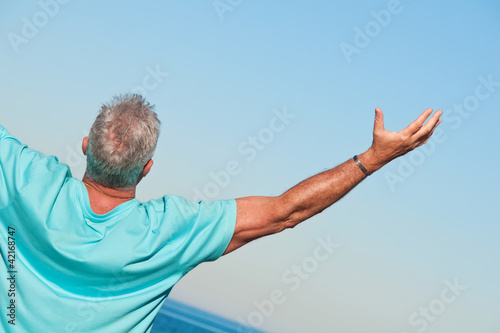 Photo: Man praising Man praising