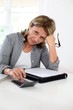 Senior woman pensioner calculating bills