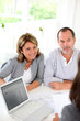 Senior couple ready to buy new house reading contract