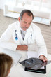 Doctor with patient looking at X-ray