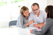 Photo: Senior couple signing financial contract Senior couple signing financial contract