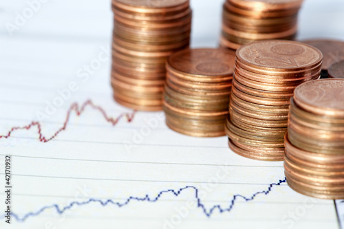 Photo: Financial chart and coins Financial chart and coins