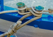 Moored fishing boat with different kinds of rope.