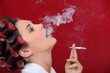 Female smoker exhaling puffs of smoke