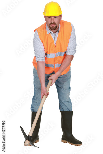 Photo: Bearded worker with pick-ax Bearded worker with pick-ax