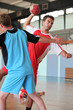 Photo: Man throwing ball during handball game Man throwing ball during handball game