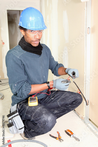 Photo: electrician taking measurements electrician taking measurements