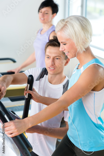Photo: Fitness young people on treadmill cardio workout Fitness young people on treadmill cardio workout