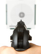 Handgun aimed on a shooting target