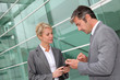 Business people exchanging phone numbers
