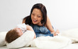 Young beautiful woman and her son having fun together