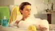 woman who has fun in a bath with foam