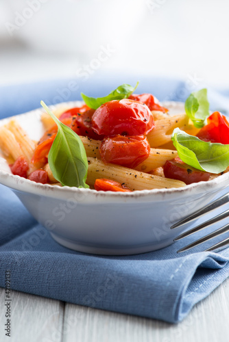 Photo: Penne pasta with cherry tomatoes and basil Penne pasta with cherry tomatoes and basil