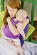 Photo: Eight months old baby sleeping in mothers hands Eight months old baby sleeping in mothers hands