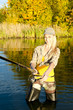 woman fishing in pond