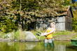 woman fishing in pond