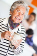 Elder woman drinking coffee