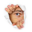 Man watches through a hole
