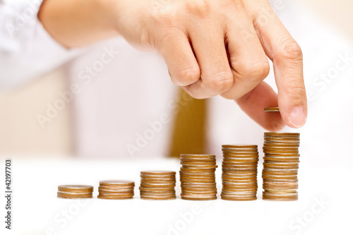 Photo: a man with rising coins a man with rising coins
