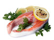 Red fish with lemon, parsley and pepper isolated on white.