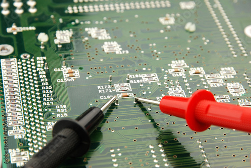 Photo: measuring a printed circuit board measuring a printed circuit board
