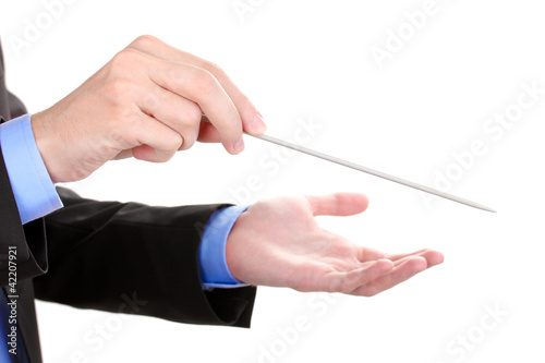 Photo: Music conductor hands with baton isolated on white Music conductor hands with baton isolated on white