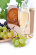 Photo: White wine bottle, glass and cask with grapes White wine bottle, glass and cask with grapes