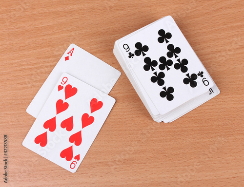Photo: Cards on wooden background Cards on wooden background