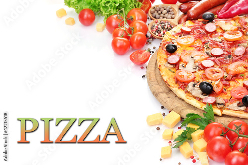 Photo: delicious pizza with vegetables and salami isolated on white. delicious pizza with vegetables and salami isolated on white.