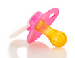pink baby's pacifier isolated on white background