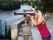 Photo: Tourist looking through telescope in Avignon, France Tourist looking through telescope in Avignon, France