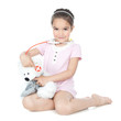 Foto: Little girl doctor with teddy bear Little girl doctor with teddy bear