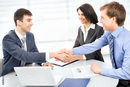 Photo: Business people shaking hands Business people shaking hands